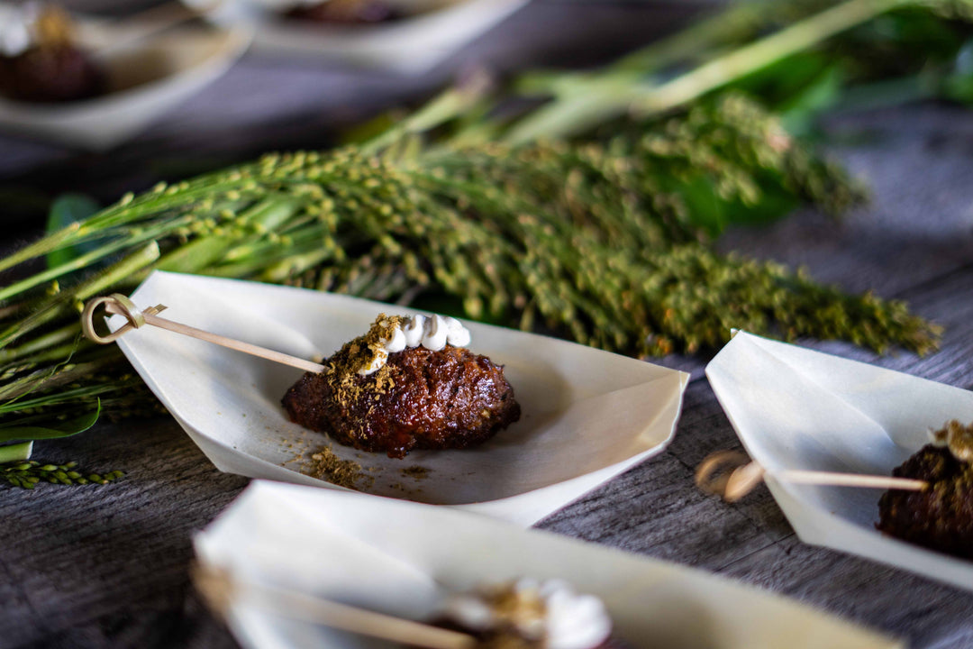 an urban element hot canape, consisting of a beautifully roasted lamb kofta on a skewer.