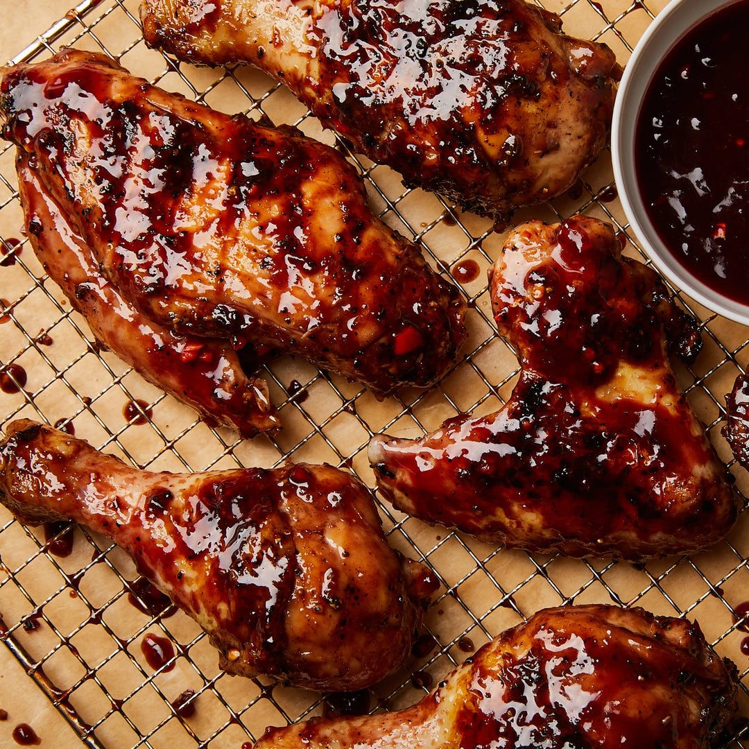 bbq glazed chicken on wooden cutting board