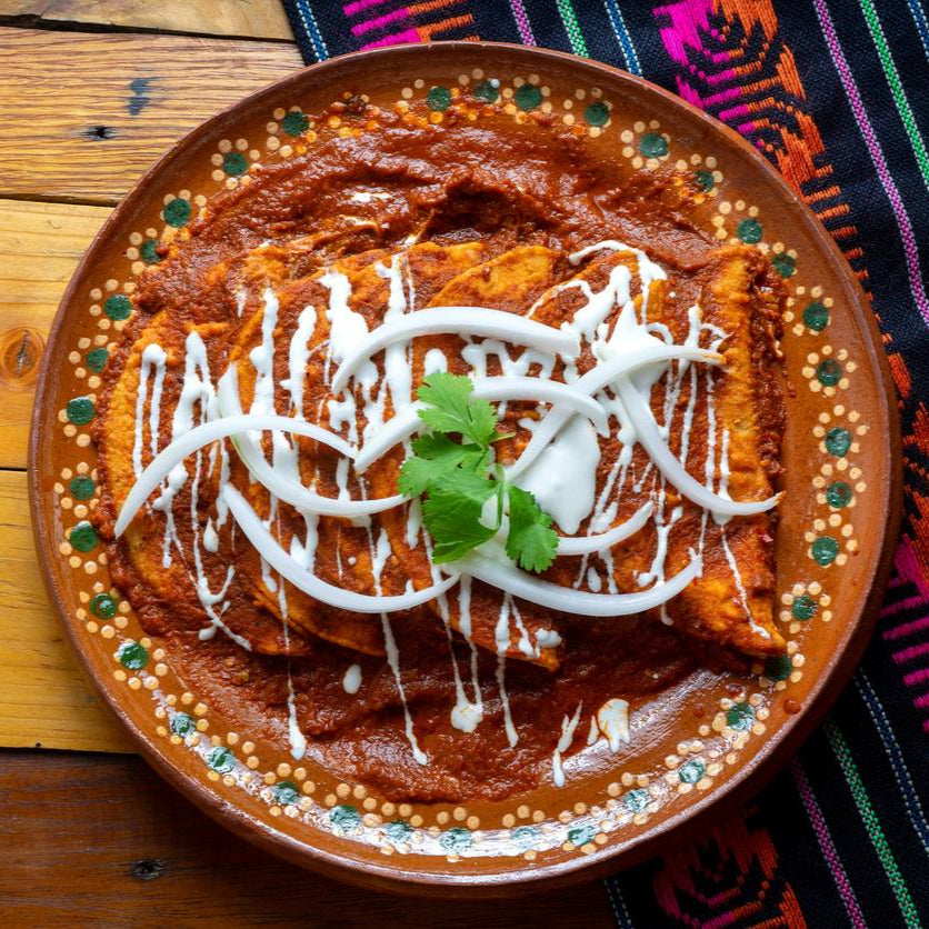braised beef enchiladas with queso fresco and red chile chimichurri